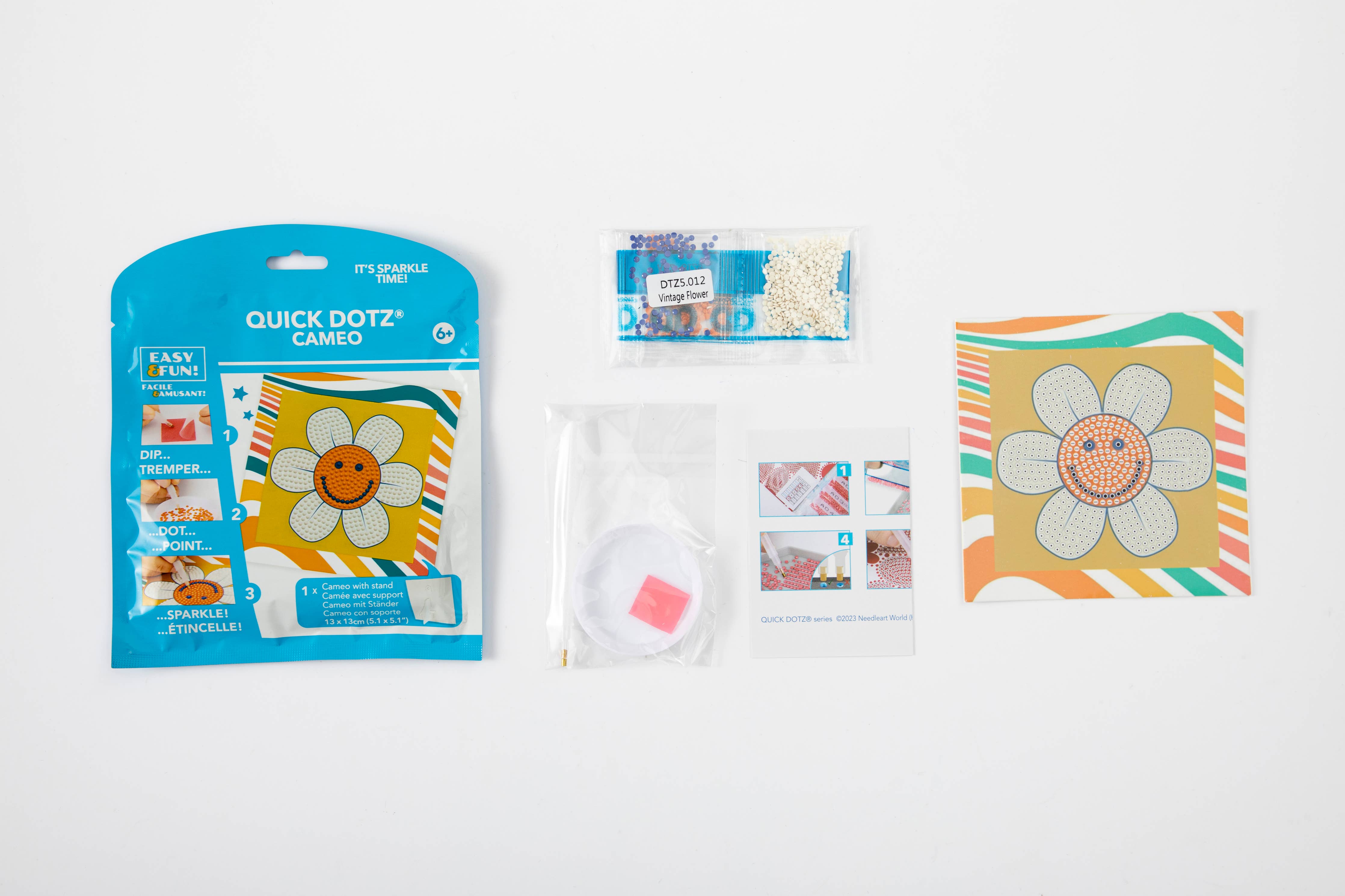 Quick Dotz Cameo packaging with a smiley flower design on a white background