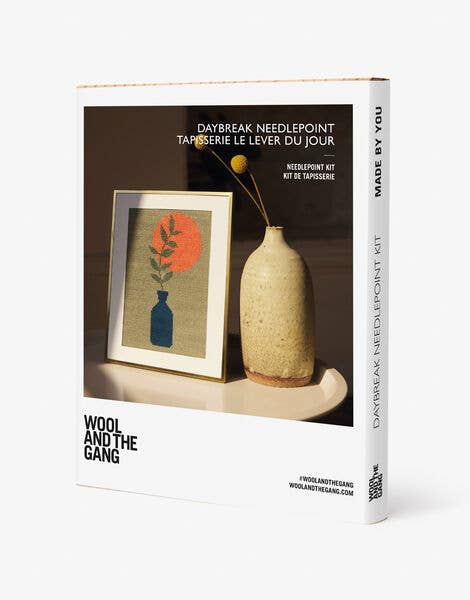 Wool and the Gang needlepoint kit packaging with a sample design and vase on a white background