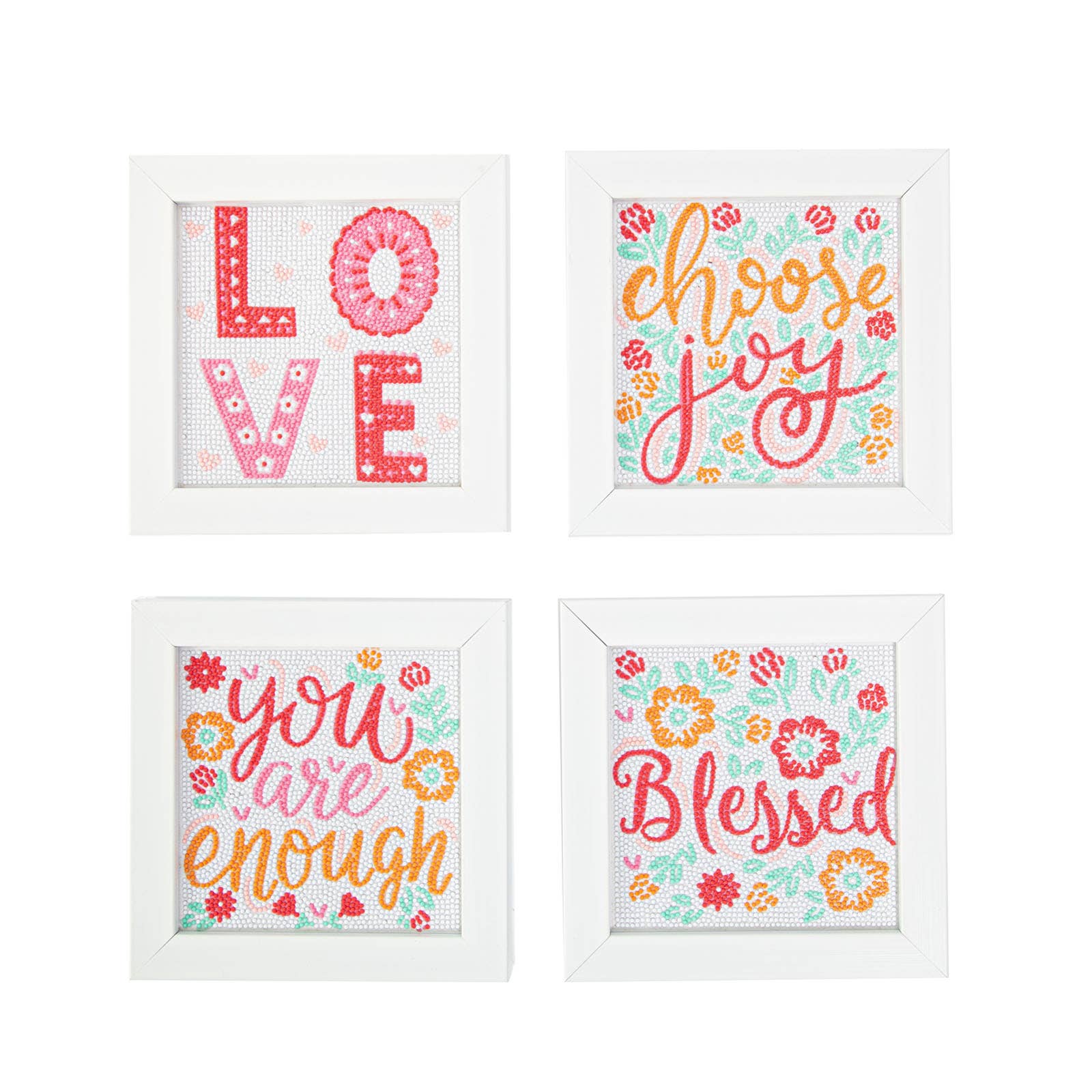 Four framed prints with motivational phrases and floral designs on a white background