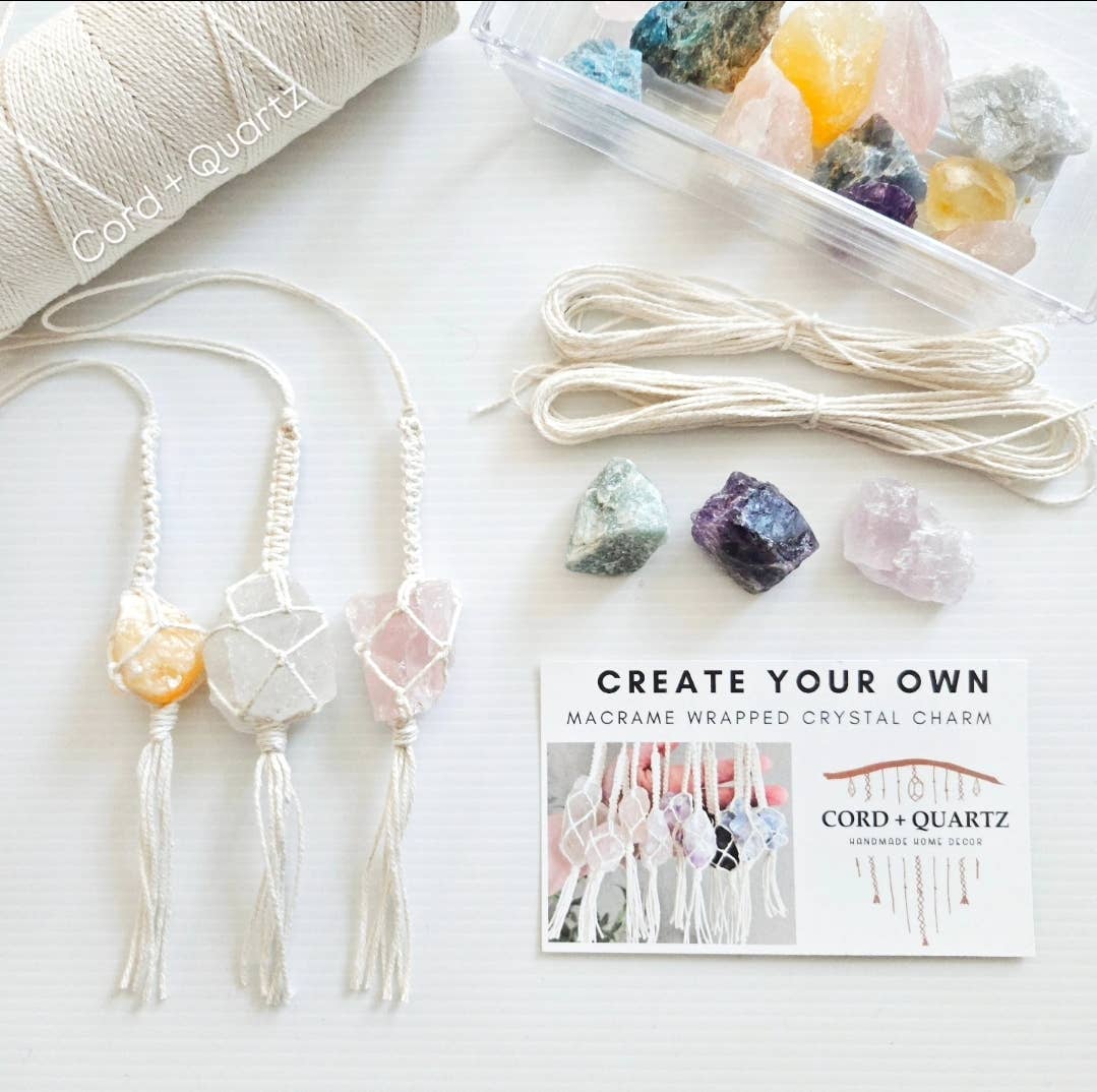 Macrame wrapped crystal charm kit with raw crystals on a white surface