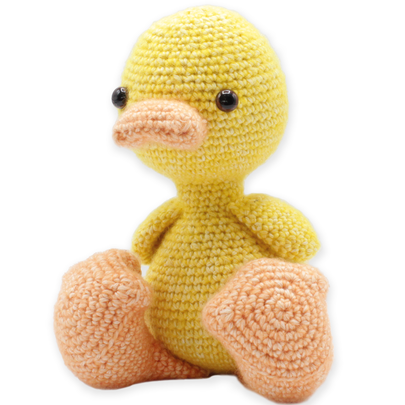 Crocheted yellow duck toy on a white background