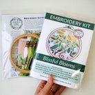 Embroidery kit with 'Blissful Blooms' design on a white background