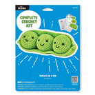 Bucilla crochet kit packaging with green crocheted peas on a blue background