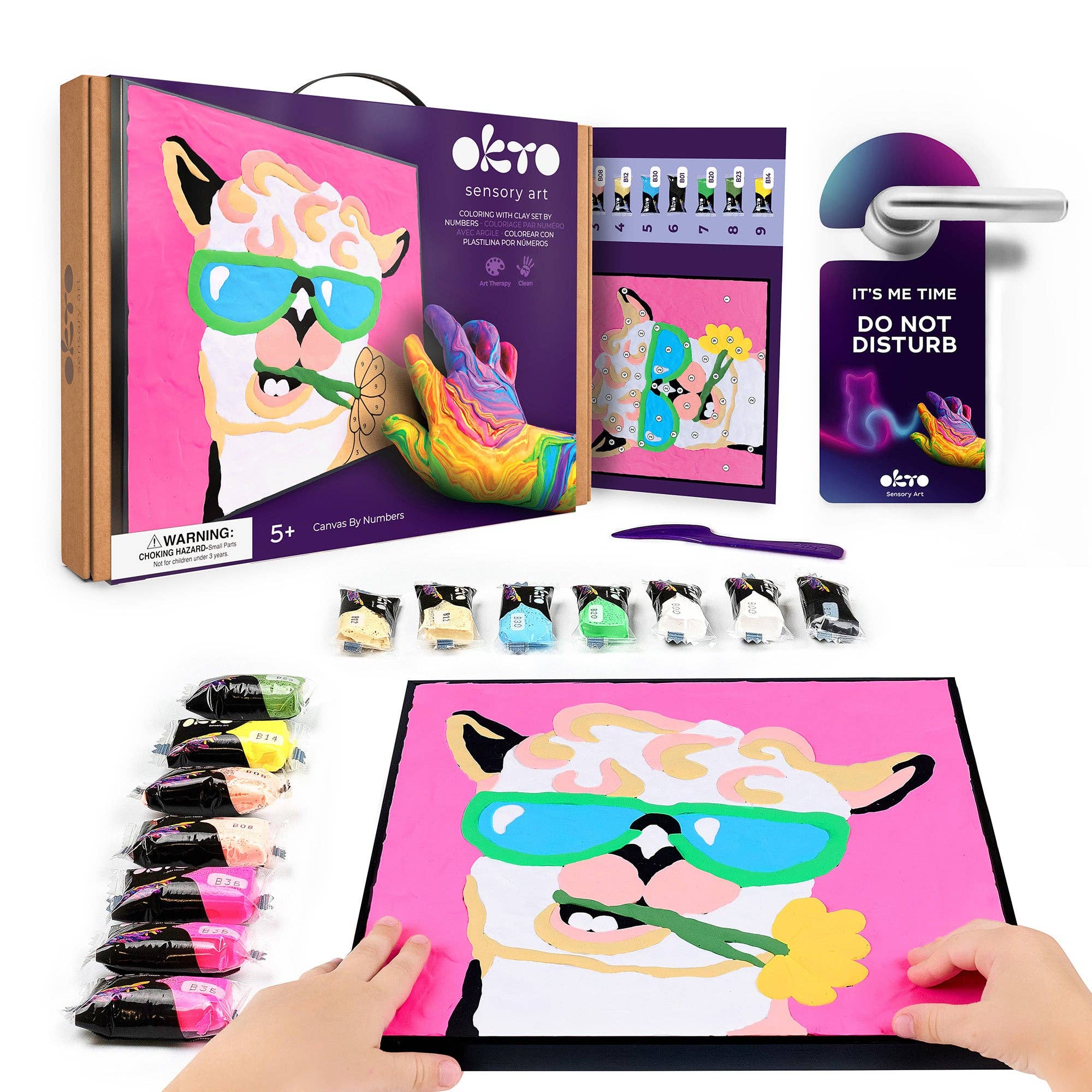 Okto sensory art kit with packaging, paint bottles, and a child's hand holding a completed artwork.