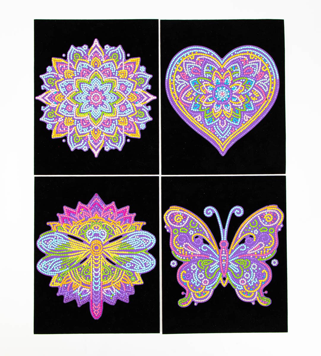 Four colorful mandala designs on a black background