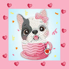 Cute dog in a pink teacup with a bow on a pink background