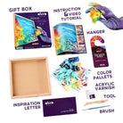 Art supply kit with box, tools, and materials on a white background