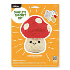 Crochet kit packaging for a mushroom with Bucilla branding on an orange background