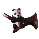 Geometric panda figurine with a brown background