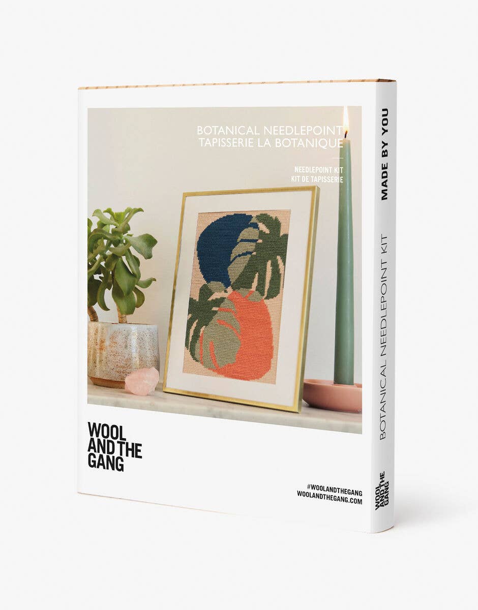 Wool and the Gang needlepoint kit packaging with a framed artwork of plants on a white background