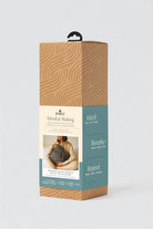 Packaging box for 'Mindful Making' with text and a person holding yarn.