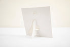 White paper with a folded corner on a white background