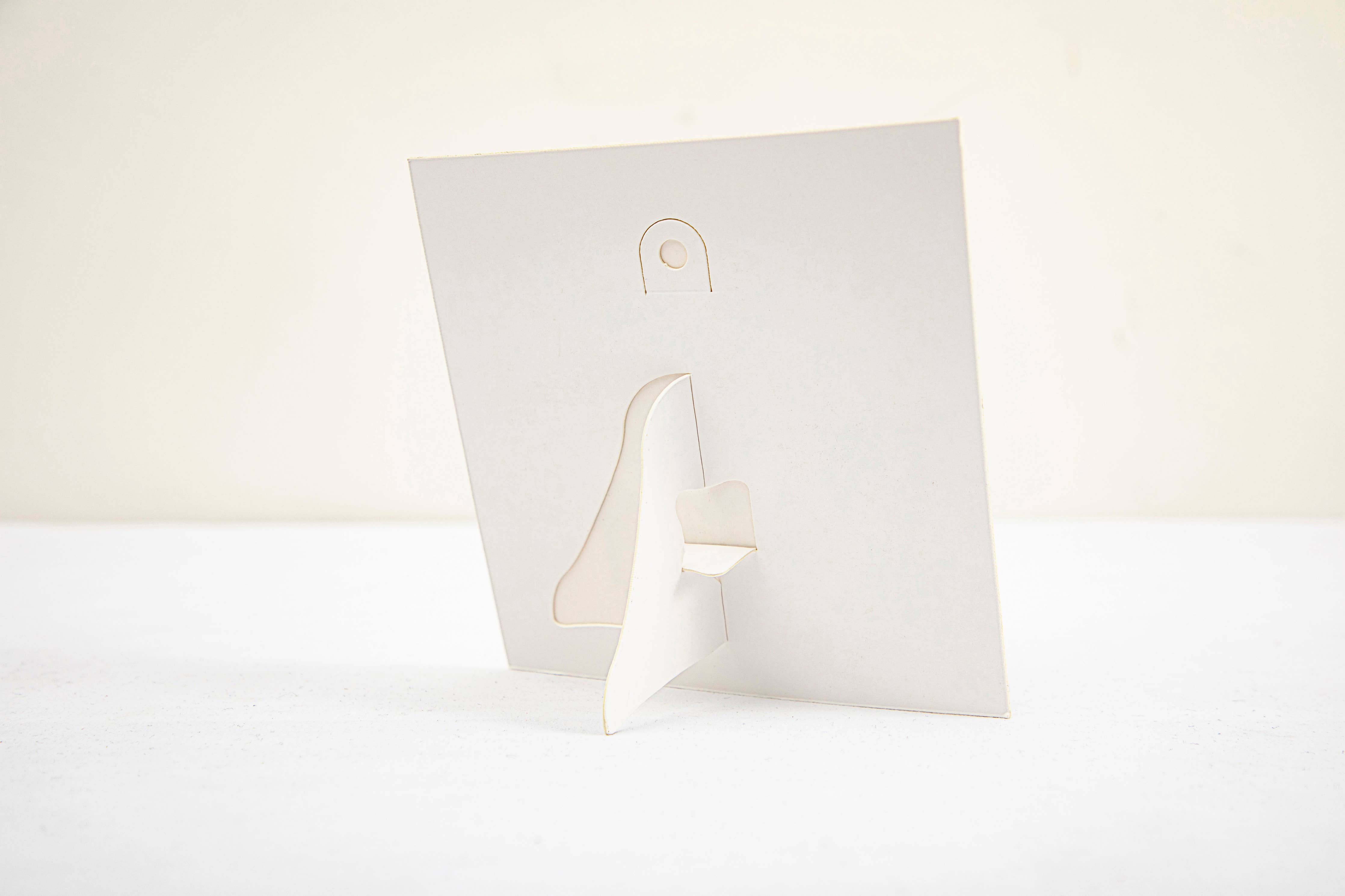 White paper with a folded corner on a white background