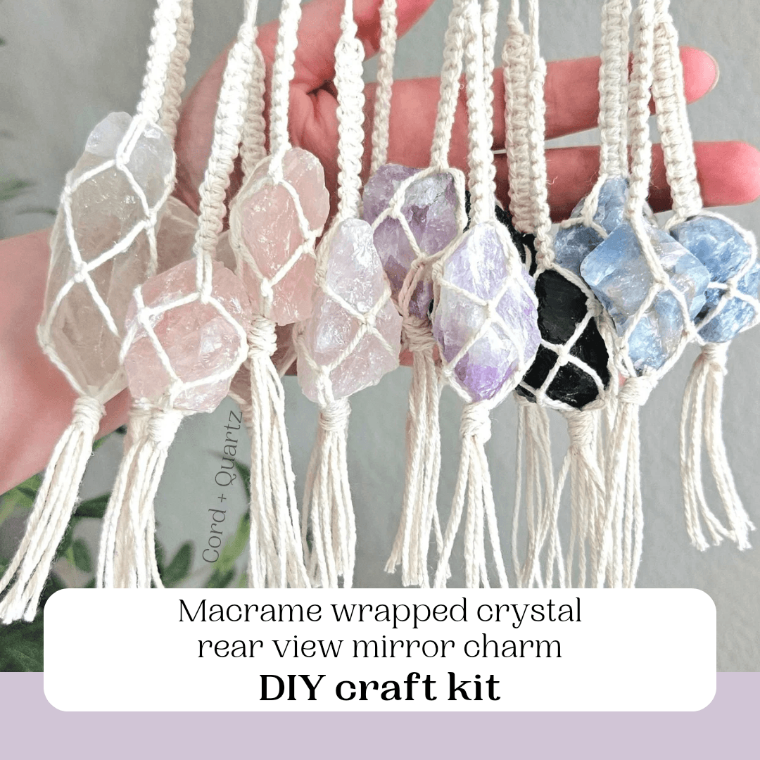 Macrame wrapped crystal rear view mirror charm DIY craft kit held by a hand against a neutral background.