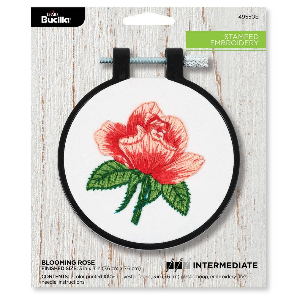 Embroidery hoop with a red rose design on a white background, featuring Bucilla branding.