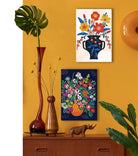 Decorative scene with floral artworks, vases, and a rhinoceros figure on a yellow wall.