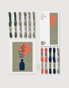 Embroidery thread set with pattern cards on a white background
