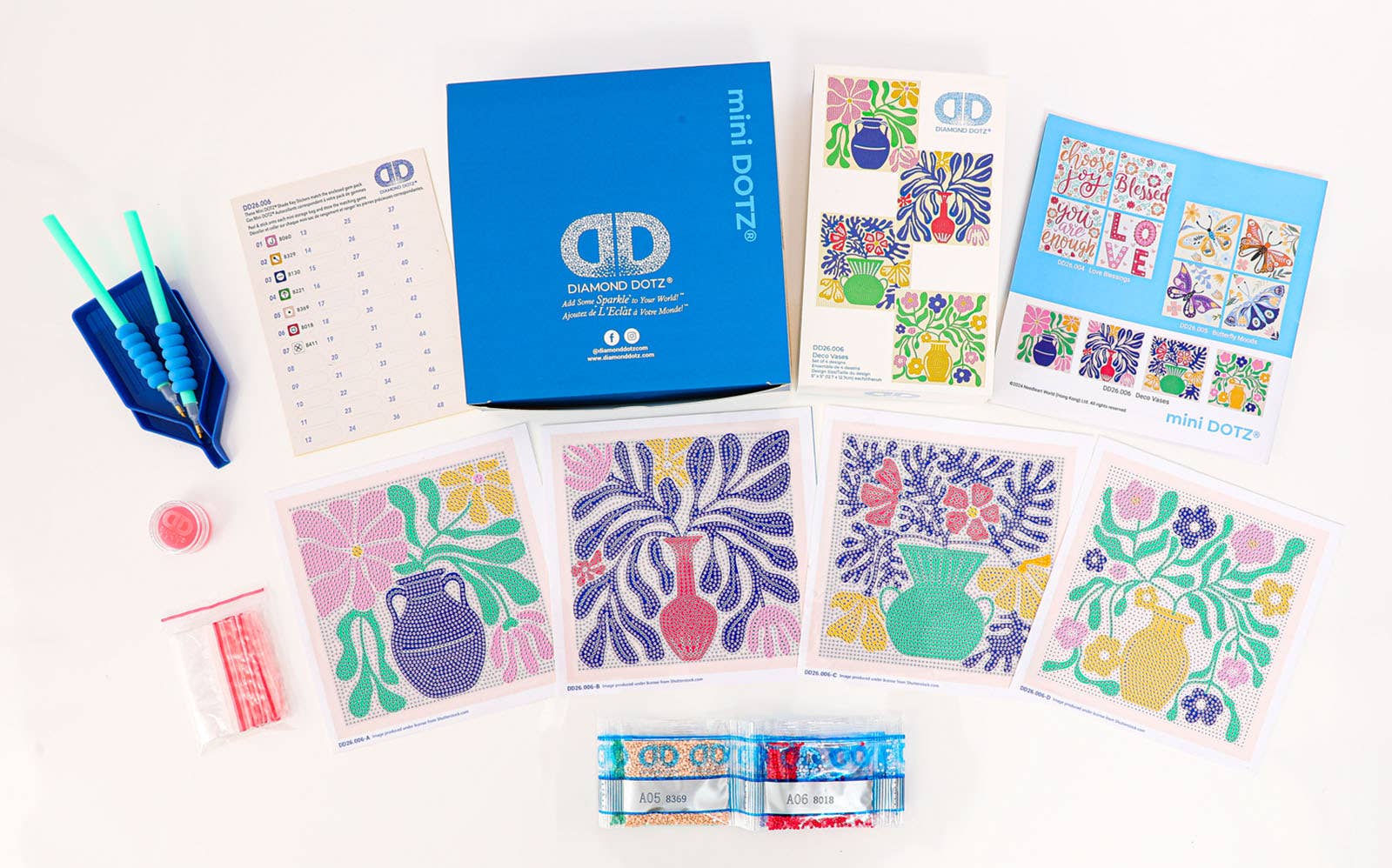 Colorful art supplies including cards and a box on a white background